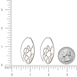 Image of silver cactus hoop earrings with ruler and quarter for size comparison.
