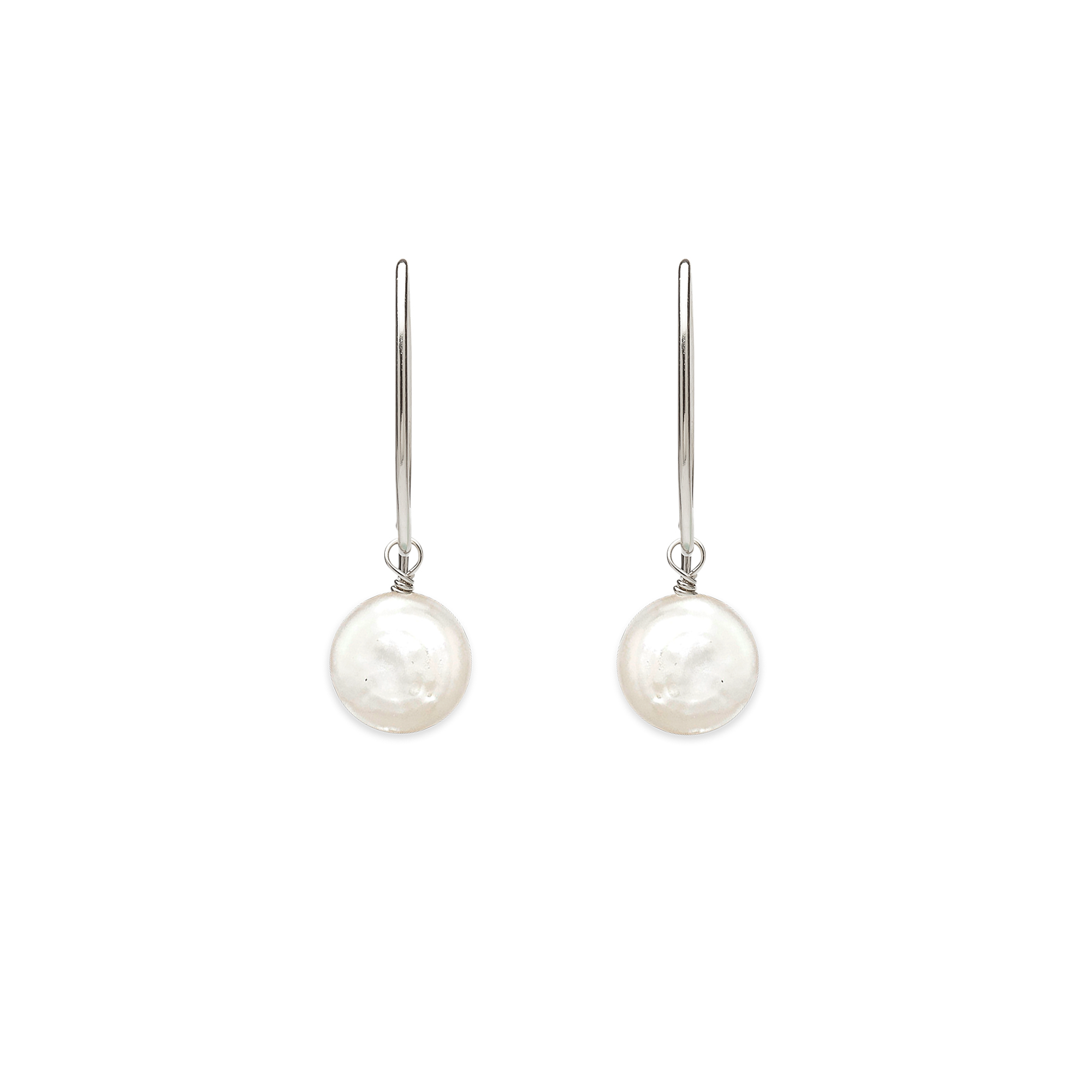 Image of silver dangle earrings with iridescent white flat coin pearl on white background