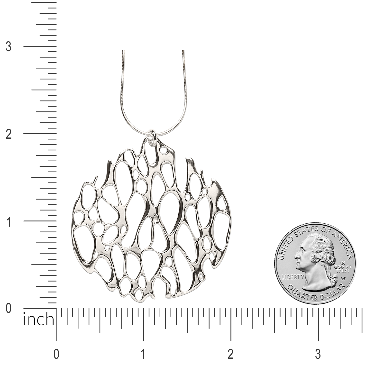 Image of large circle prickly pear pendant with ruler and quarter for size comparison.