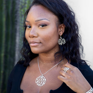 silver cactus skeleton jewelry on woman