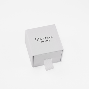 white ring box with lila clare logo
