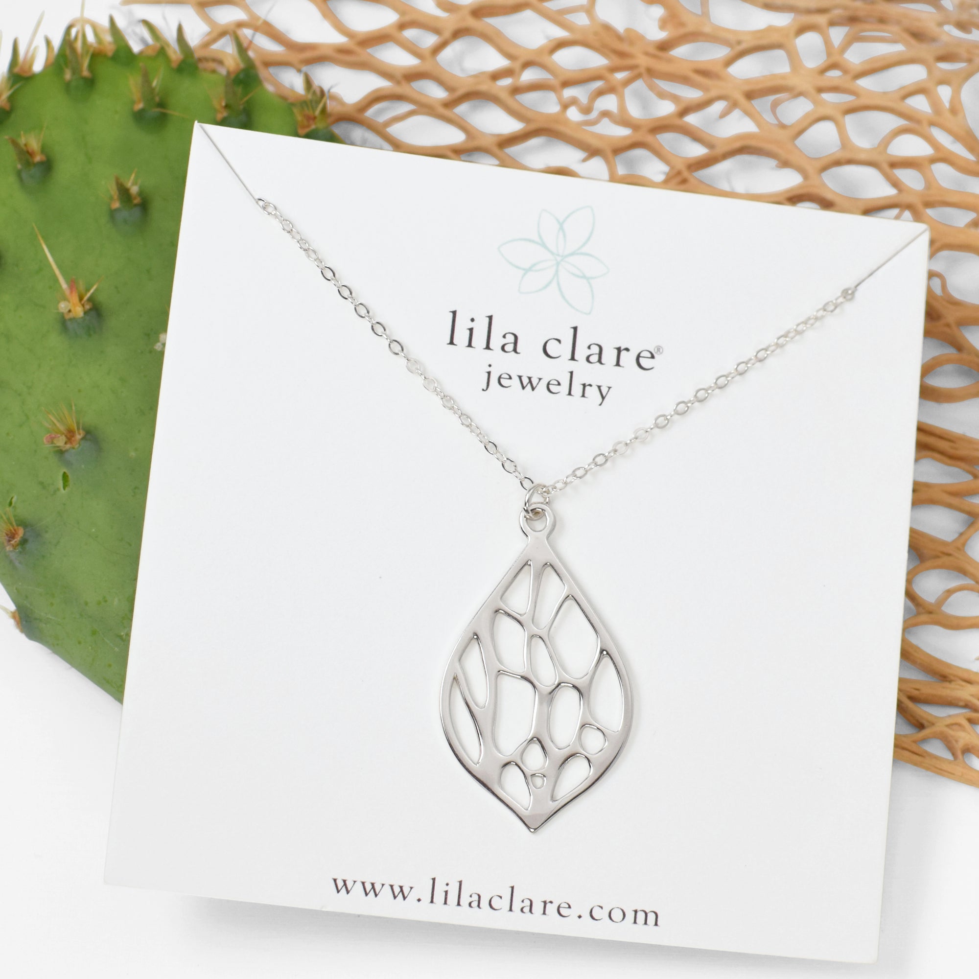 silver pointed teardrop necklace with organic pattern
