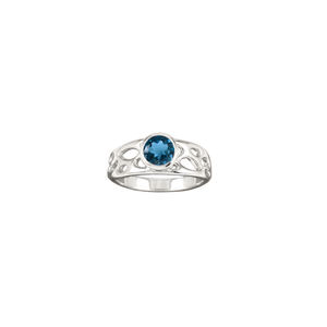 sterling silver botanical solitaire ring with London Blue Topaz on white background