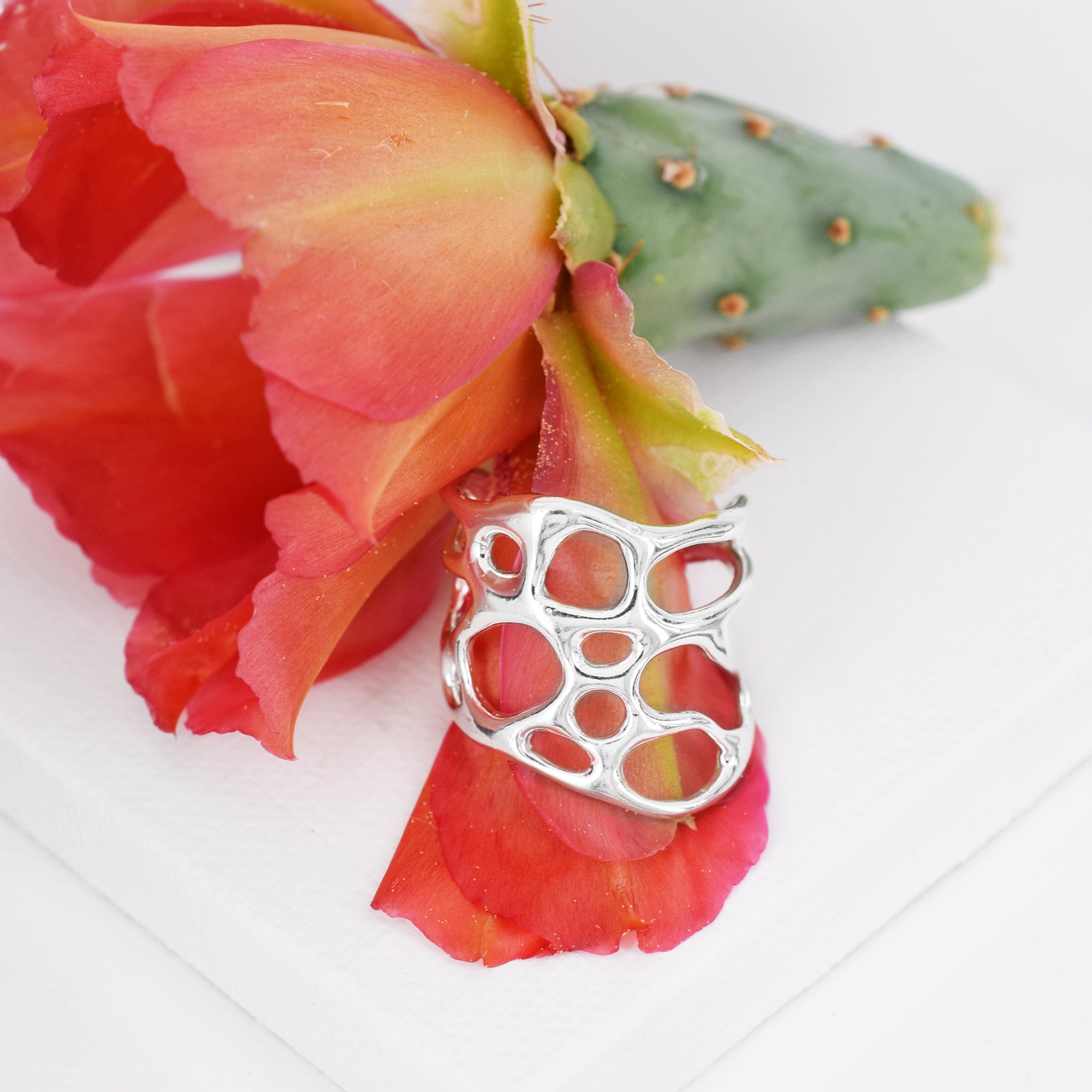 silver organic wide band cactus ring on white background