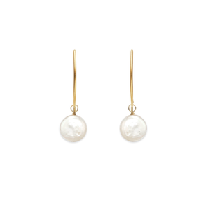 Image of gold dangle earrings with white coin pearl on white background