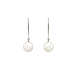 Image of silver dangle earrings with iridescent white flat coin pearl on white background