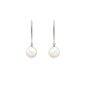 Image of silver dangle earrings with iridescent white flat coin pearl on white background