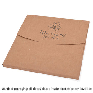 Image of kraft paper envelope packaging with printed Lila Clare Jewelry on white background