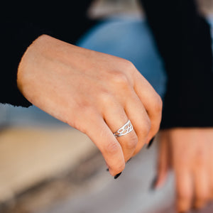 silver cactus band ring on woman's finger