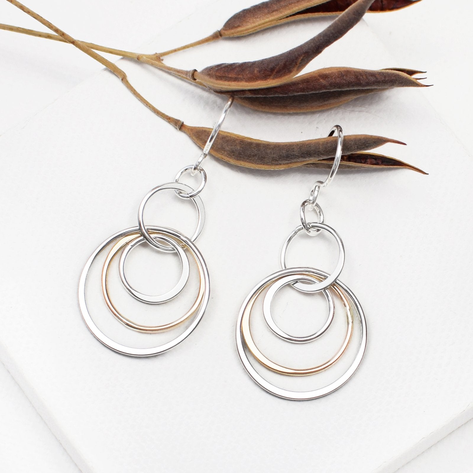 two tone circle dangle earrings