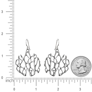 silver cactus earrings on white with ruler for size