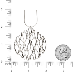 Image of large circle prickly pear pendant with ruler and quarter for size comparison.