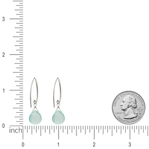 Image of silver and gemstone dangle earrings with ruler and quarter for size comparison