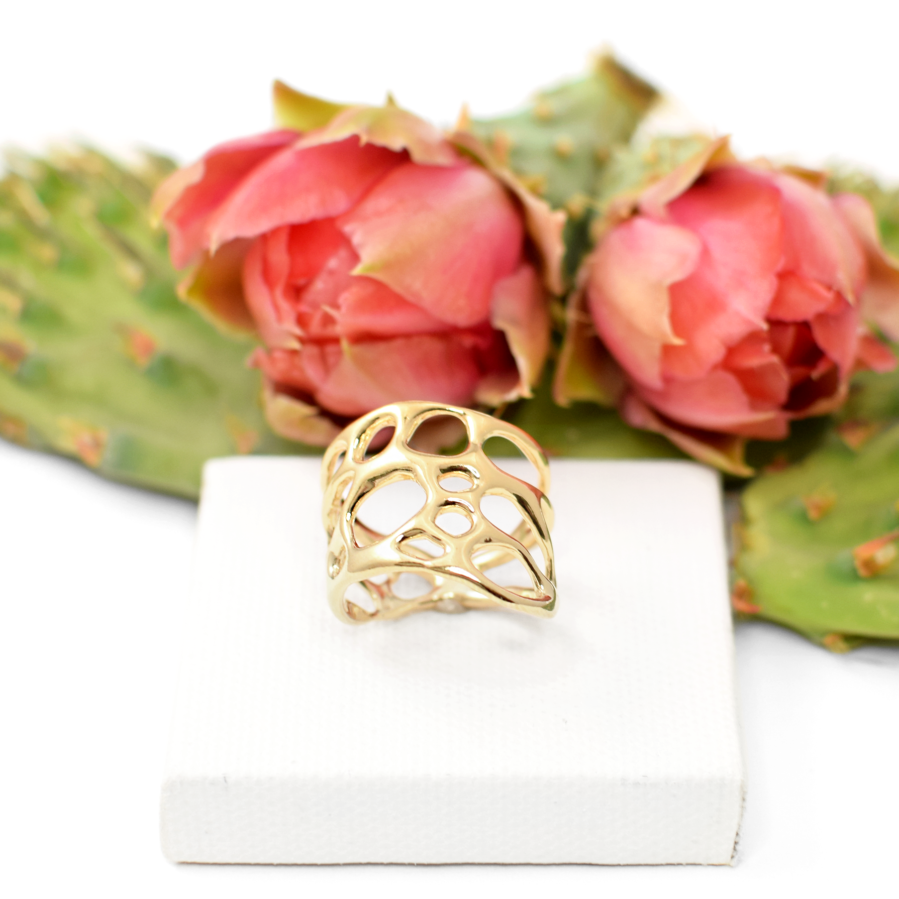 handmade botanical ring on white background with prickly pear cactus